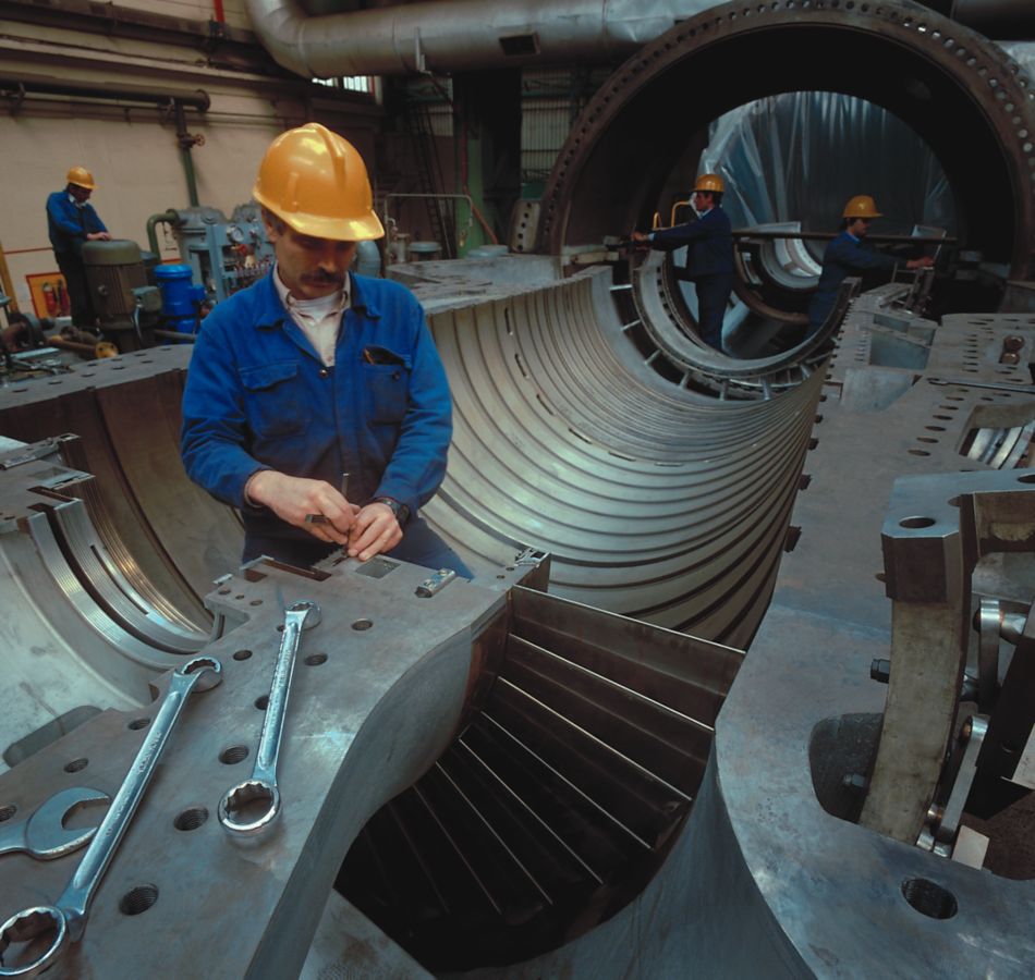 Person working on Turbine Casing