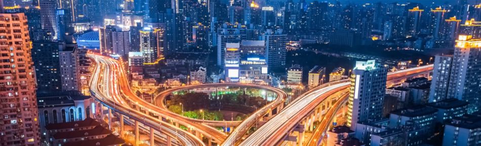 City with Cars on Highways at Night Banner