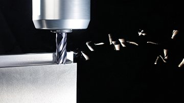 Solid Carbide End Mill Cutting a Material with Chips Flying