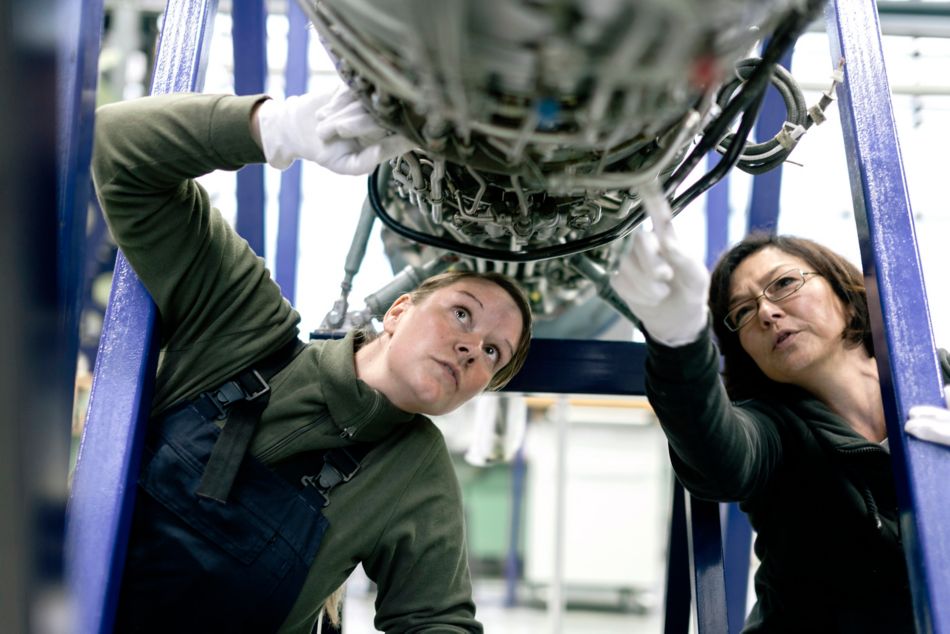 Two Engineers Working on Aerospace Component