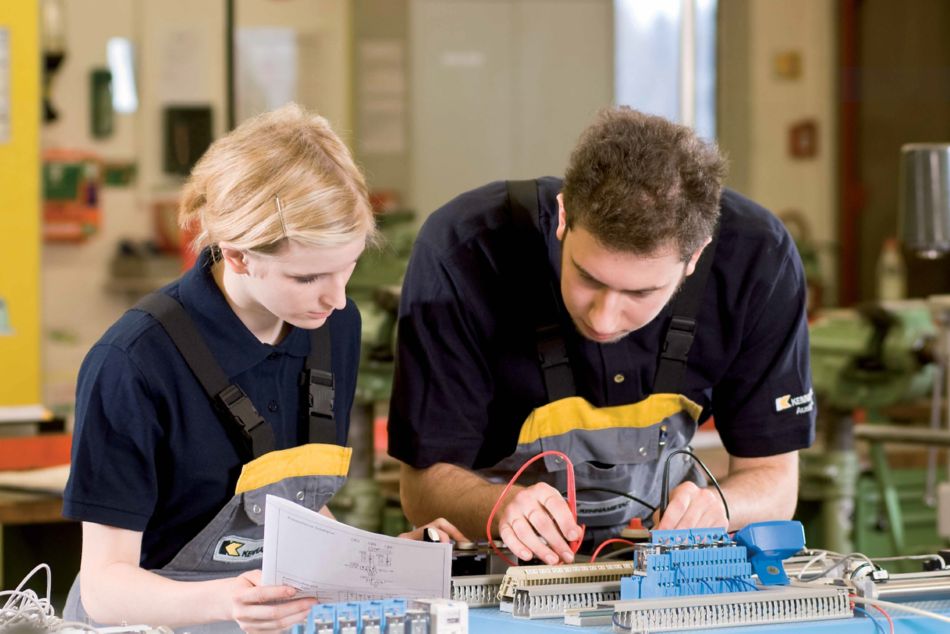Two Kennametal Electrician apprentices at work