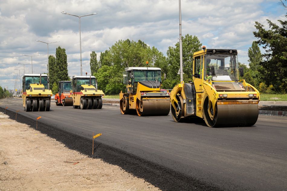 Group of heavy vibration roller compactors. Asphalting. Road construction.