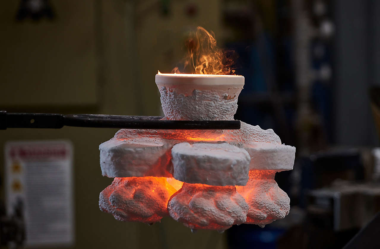 Investment casting process. Component with fire.
