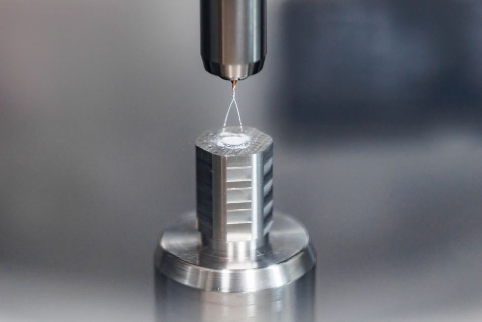 Kennametal KenDrill Micro 2xD Solid Carbide Drill with Coolant about to cut a workpiece