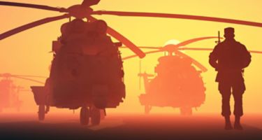 A group of military helicopters and the silhouette of a soldier.