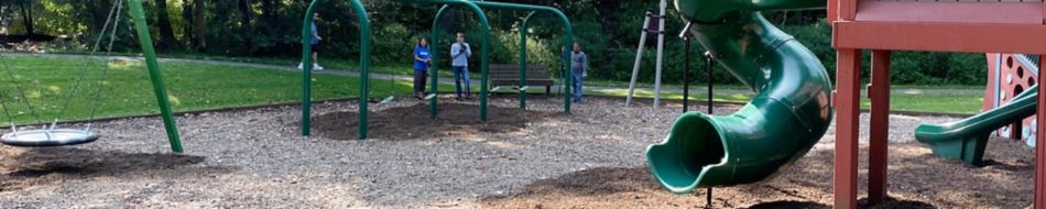 Kennametal Employees Working at a Playground Skinny Banner