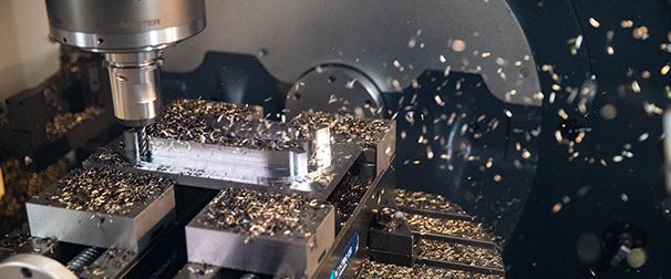 Kennametal solid end mill milling a workpiece with chips flying