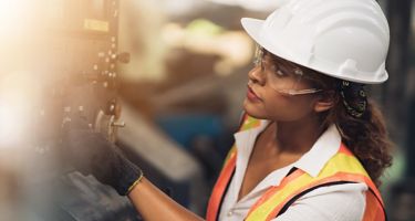Woman Operating a Machine
