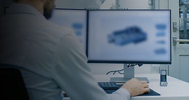 Man Working on CAD Program at Desk