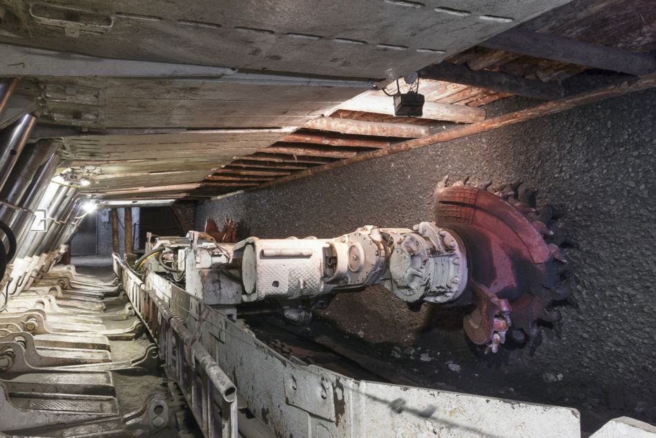 Longwall Mining: Shearer, with two rotating cutting drums and movable hydraulic powered roof supports called shields.