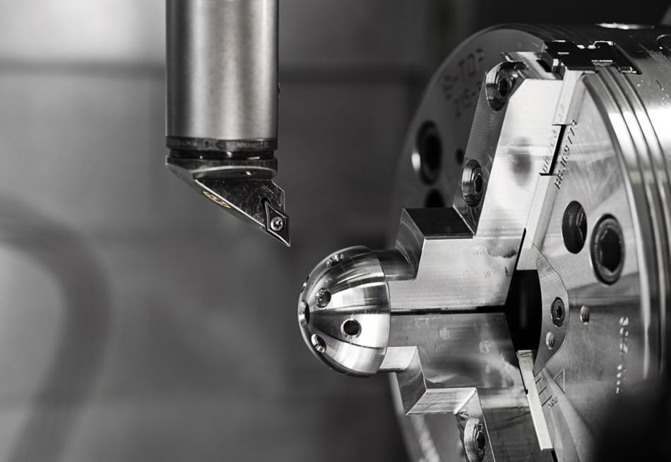 Kennametal TopSwiss Turning Insert machining an acetabular cup