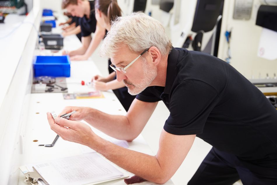 Man Inspecting Tool