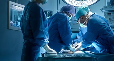 Medical Team Performing Surgical Operation in Modern Operating Room