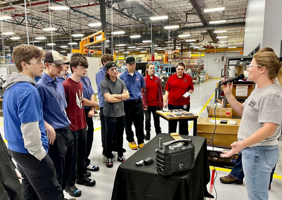 Group of students at Kennametal MFG Day talking to Kennametal employee