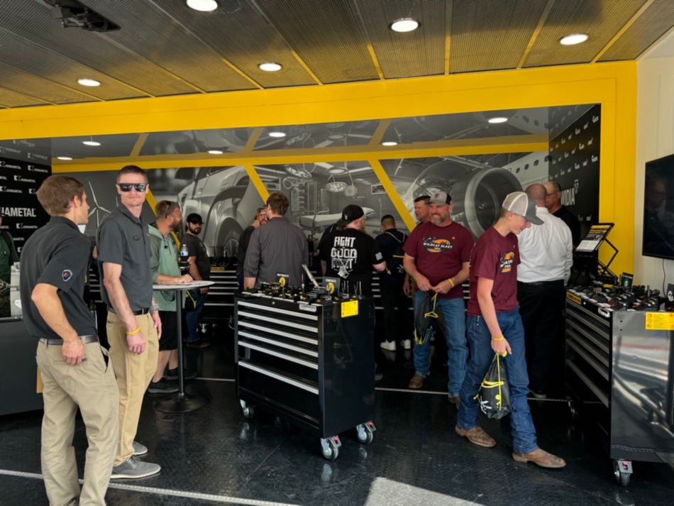 People exploring Kennametal's Metal Cutting Tour Truck at the Titans of CNC Event in 2024