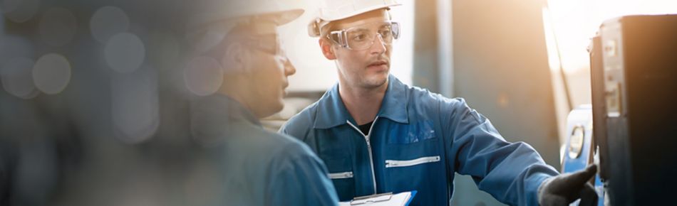 Two Shop Workers in Safety Gear Working Banner