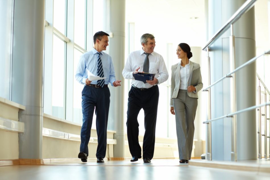 three people in hallway