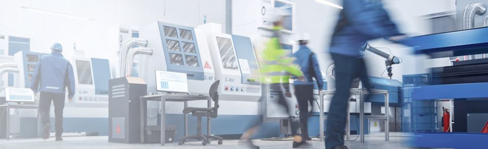 Team working in a Busy CNC Machine Shop banner