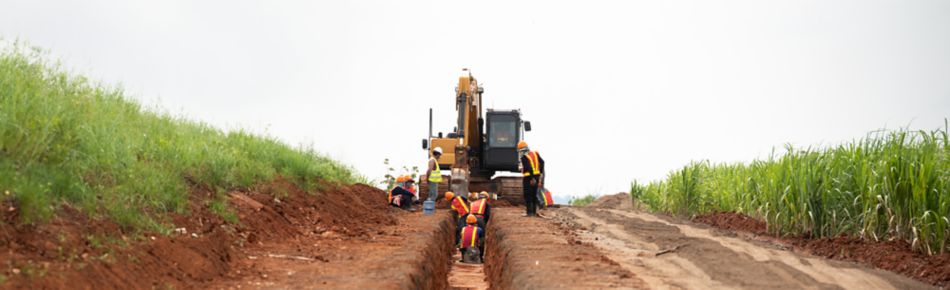 Machine digging a trench