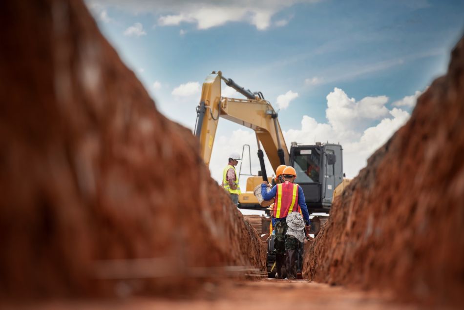 Machine digging excavation water drainage at construction site