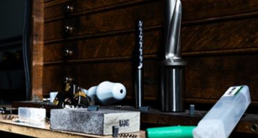 WIDIA tooling next to a wooden tool box