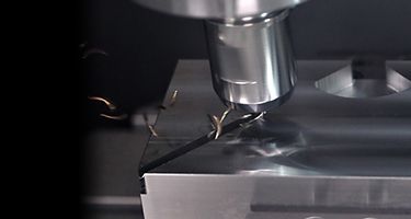 WIDIA Hanita VariMill XTREME solid end mill cutting metal with chips flying