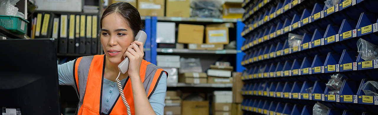 Woman in Stock Room on Phone Banner